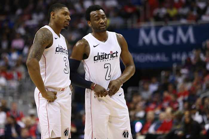 Washington Wizards guard Bradley Beal (3) talks with Washington Wizards guard John Wall (2) against the Toronto Raptors in the second quarter in game four of the first round of the 2018 NBA Playoffs at Capital One Arena. The Wizards won 106-98. Mandatory Credit Geoff Burke-USA TODAY Sports